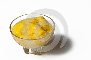 Grinded orange in bowl isolated on a white background.Fruit.Copy space