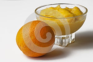 Grinded orange in bowl isolated on a white background.Fruit.Copy space