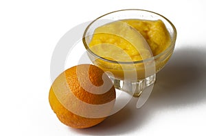 Grinded orange in bowl isolated on a white background.Fruit.Copy space