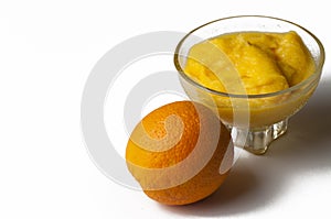 Grinded orange in bowl isolated on a white background.Fruit.Copy space
