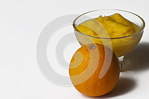 Grinded orange in bowl isolated on a white background.Fruit.Copy space