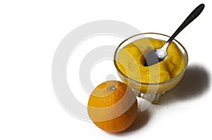 Grinded orange in bowl isolated on a white background.Fruit.Copy space