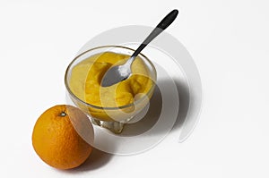 Grinded orange in bowl isolated on a white background.Fruit.Copy space