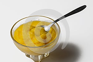 Grinded orange in bowl isolated on a white background.Fruit.Copy space