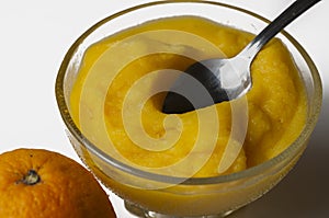 Grinded orange in bowl isolated on a white background.Fruit.Copy space