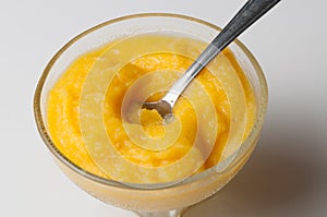 Grinded orange in bowl isolated on a white background.Fruit.Copy space