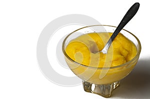 Grinded orange in bowl isolated on a white background.Fruit.Copy space