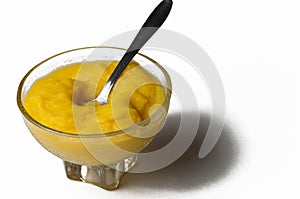 Grinded orange in bowl isolated on a white background.Fruit.Copy space