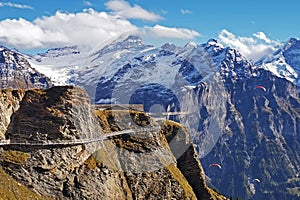 Grindelwald first cliff walk, in Switzerland Jungfrau mountain with upper air parachuting