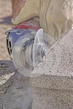 Grinder tool cutting cinder block