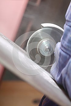 Grinder worker cuts a stone the electric tool
