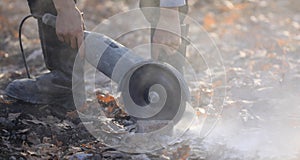 grinder worker cuts a stone the electric tool, construction work