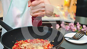 Grinding black pepper with a manual meat grinder