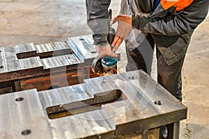 Grinding burrs and metal with an angle grinder with sparks