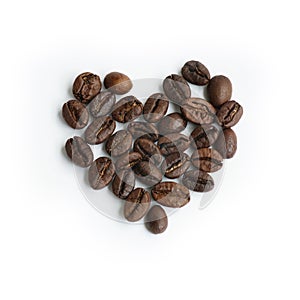 Grinding coffee beans similar heart on white background