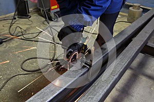 Grinding metal. Grinding wheel. Sparks are flying