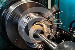 Grinding a metal inner hole on a circular grinding machine with sparks in the metalworking industry