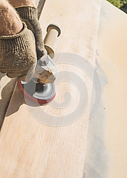 Grinding of an oak board with an angle grinder