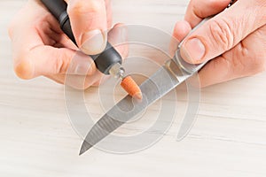 Grinding an old knife with rotary grindstone