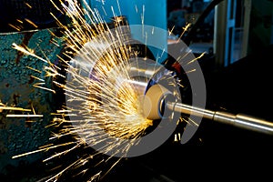 Grinding operations with an end abrasive wheel on a circular grinding machine with sparks