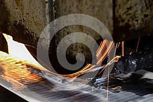 Grinding of parts on a machine, sparks from an abrasive wheel