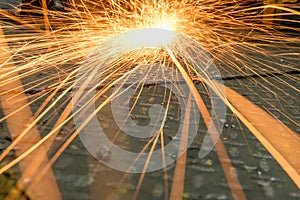 Grinding  sparks of tools on steel in factory