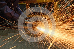 Grinding  sparks of tools on steel in factory