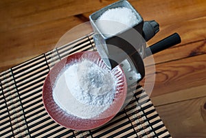 Grinding of sugar to the powder.