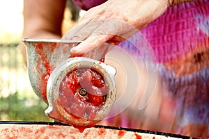Grinding tomatoes