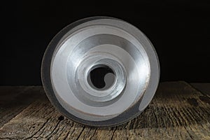 Grinding wheel on a wooden board