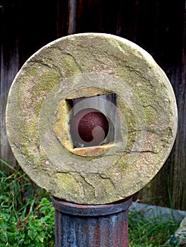 Grindstone with cannonball photo