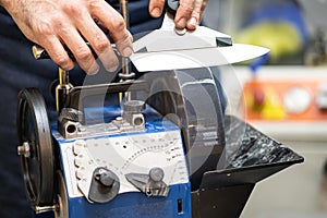 Grindstone close-up. Electric Knife Sharpening Machine photo