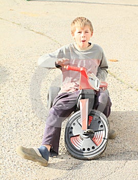 Grinning boy on motorbike