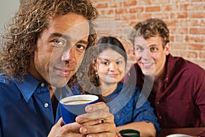 Grinning Man with Coffee Mug