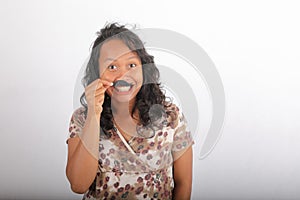 Grinning woman with mustache