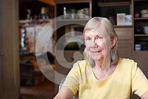 Grinning woman in yellow shirt