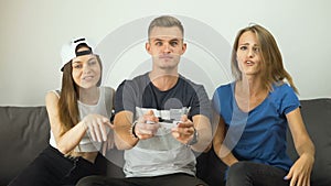 Gripped teens play video game