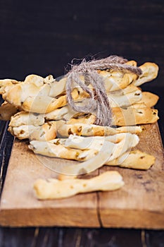 Grisini on wooden plate