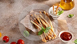 Grissini breadsticks with sauces