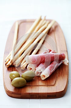 Grissini with ham and olives
