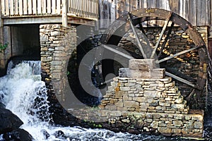 Grist mill and waterwheel for grain production photo