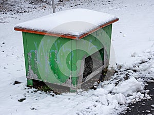 Grit container in winter with snow