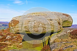 Gritsone rock perched precariously on Curbar Edge in Derbyshire