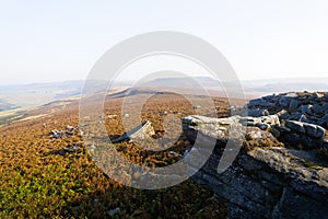 From the gritstone rocks of Surprise View over a misty Hathersage Moor on an autumn morning