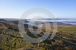 From the gritstone slopes of Stanage Edge, across a misty Derbyshire