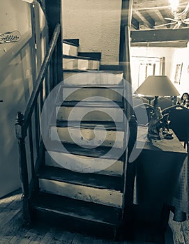 Gritty old image stairway leading up from hall photo
