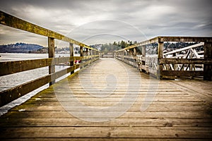 Gritty wooden pier on a cloudy day