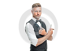 grizzled man hairdresser with razor blade and scissors in bow tie isolated on white background