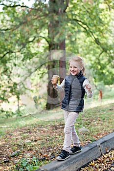 Grl is walking along the curb