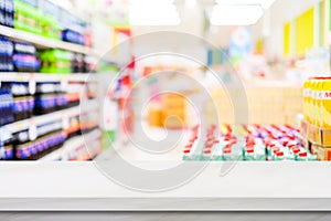 Grocery background, Empty white table top, counter, desk over blur perspective supermarket store with bokeh light background,